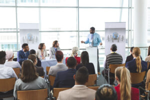 Male speaker speaks about DEI in a business meeting