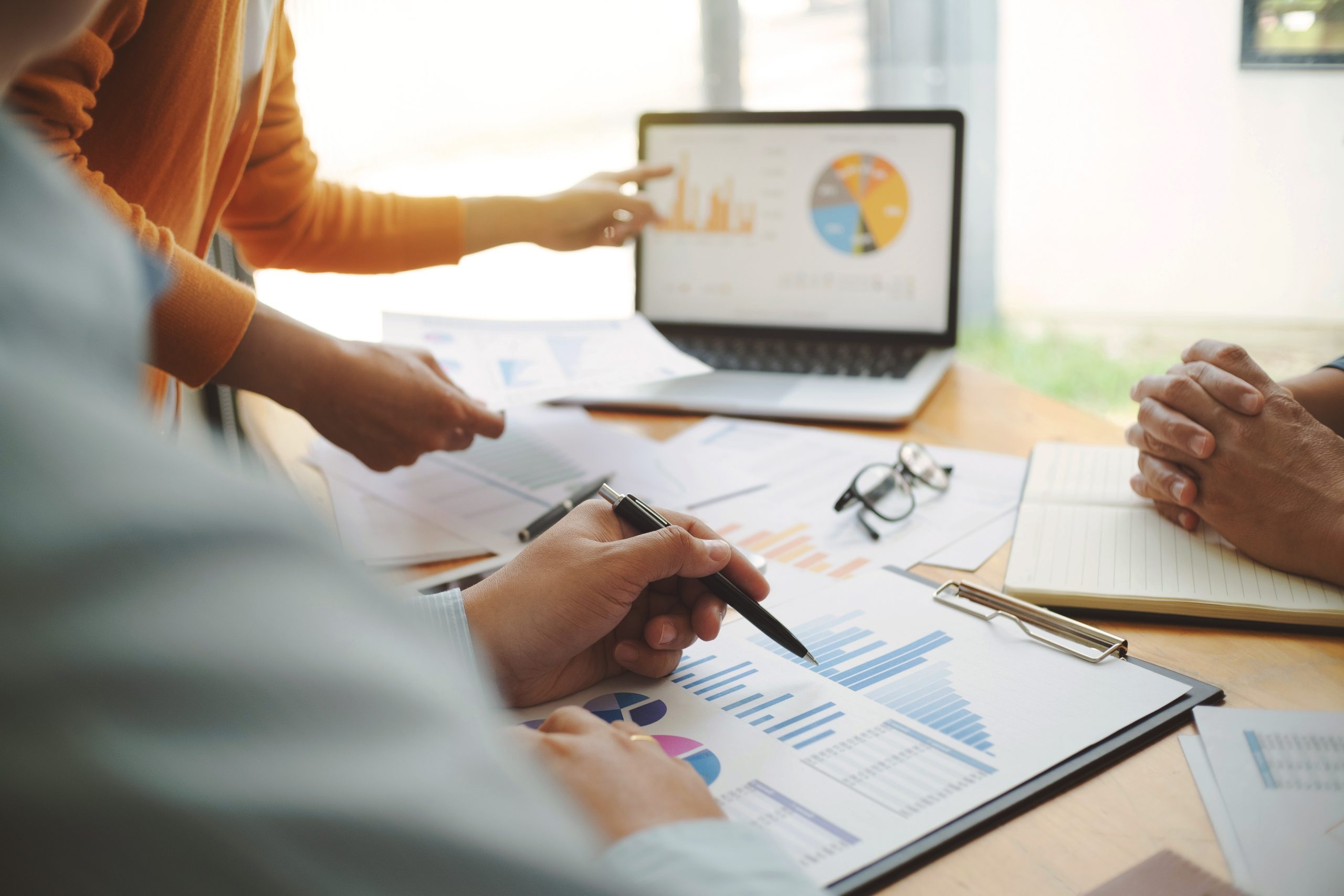 Team of Business people discussing a project of financial plan for marketing